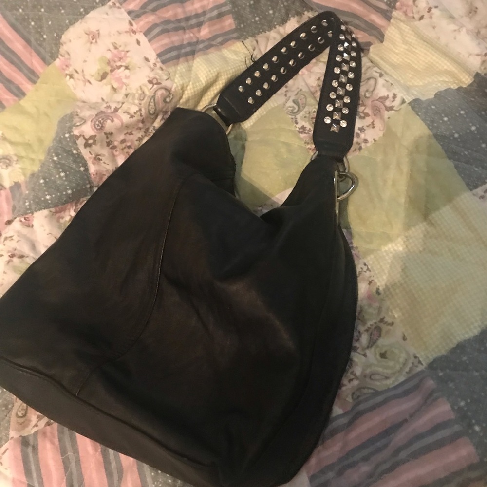 Carlos Santana black bag